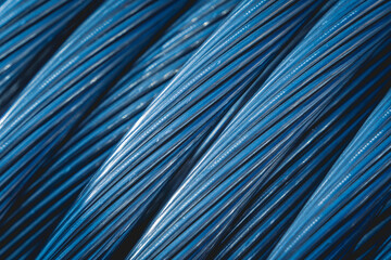 Fototapeta premium Background of wooden coils of electric cable outdoor.