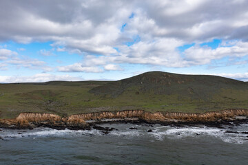 The Pacific Ocean meets the beautiful shoreline of Central California, not far from Morro Bay. This scenic region, between Los Angeles and San Francisco, is a popular tourist destination.