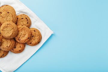 Oatmeal cookies on a napkin on a blue background
