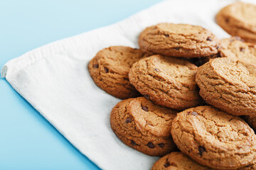 Oatmeal cookies on a napkin on a blue background