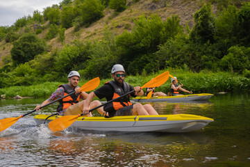 Friends kayaking together