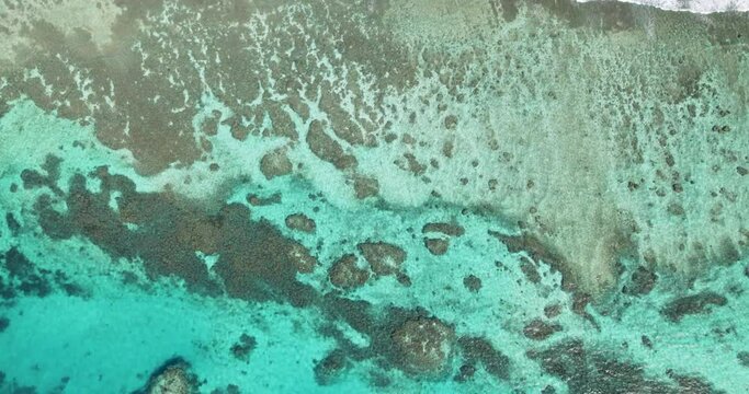 Aerial top view of coral reef and turquoise ocean water in Miyako Island Okinawa Japan natural texture background