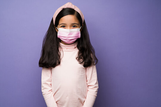 Safe Kid Using A Face Mask To Prevent Covid