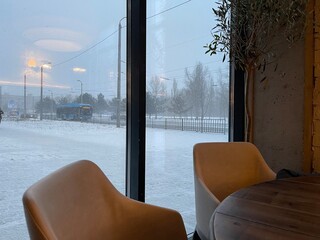 chairs in a cafe near the windows, winter outside