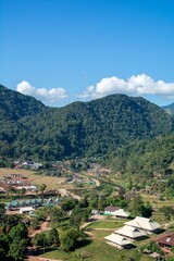 Aerial view of Sapun Village at sunrise in the valley of mountains with misty mountain range