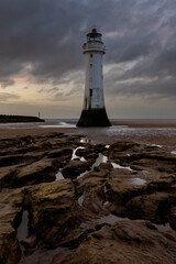 Naklejka premium Perch Rock lighthouse at sunset