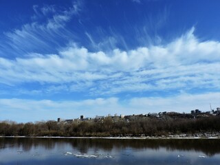 clouds over the spring  river