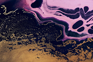 Fluid Art. Golden metallic, black and pink wriggling waves. Marble effect background or texture