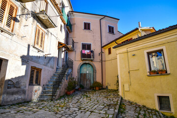 A small street between the old houses of Pignola, a small town in the province of Potenza in Basilicata, Italy.
