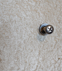 Selective focus on a typical drywall anchor installation .