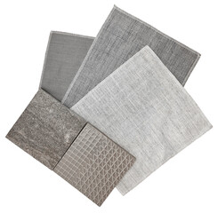 collection of gunny textile fabric samples in grey color tone matched color with grey stone and grey graphic tiles. stacked of drapery fabric samples isolated on background with clipping path.