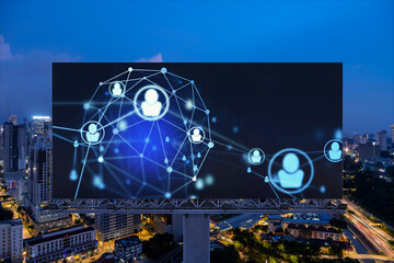 Glowing Social media icons on billboard over night panoramic city view of Kuala Lumpur, Malaysia,...