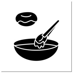 Doughnut icing glyph icon. Donuts dipping in sugar glaze or coating bowl. Concept of homemade pastry and bakery dressing and decoration. Filled flat sign. Isolated silhouette vector illustration