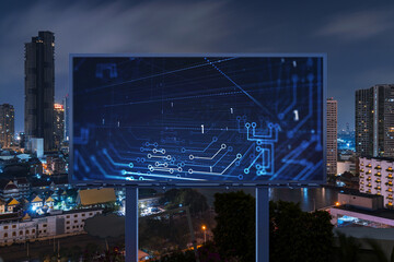 Information flow hologram on road billboard, night panorama city view of Bangkok. The largest...