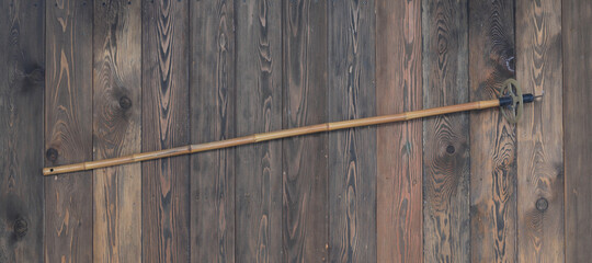 vintage bamboo ski pole on wooden background