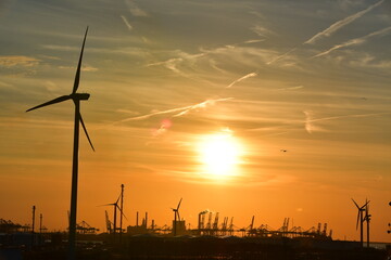 Sunset harbour - including cranes and other port machinery