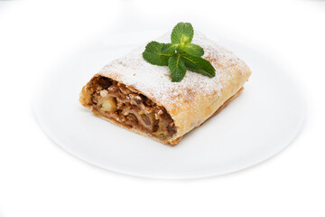 Traditional Viennese strudel with apples and raisins isolated on a white background