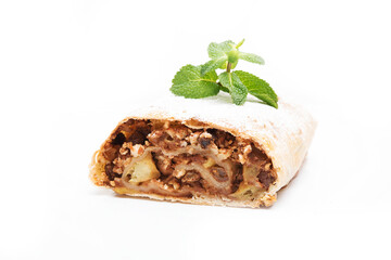 Traditional Viennese strudel with apples and raisins on a white background