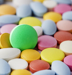 bright medical background from pills of different colors