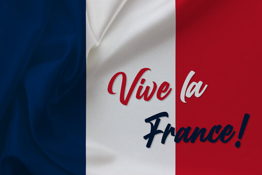 "Vive la France" text on waving silk French flag background. French text translate is "Long live France". Concept design for poster, banner, greeting card etc.