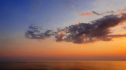Naklejka na ściany i meble Sunset of sea beach and colorful sky background.