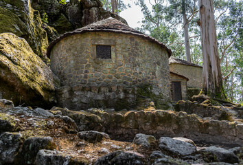 Defocused stone wall next to old reconstructed houses in Castro de São Lourenço, Vila Chã - Esposende PORTUGAL