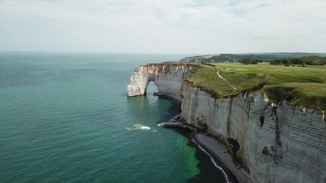 Etretat, France. View from drone of the beautiful chalk cliffs of Etretat, France. Coastline of Normandy in the evening