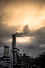 The smoking chimney of a large thermal power plant. Working plant against the background of the...