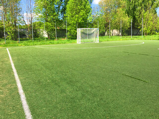 football field with markings.Texture of natural green grass on the football field. green grass stadium background. Top view of soccer field. Center of soccer or soccer field background. green grass