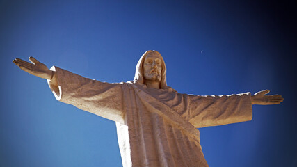 statue of jesus and clear sky