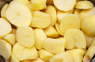 Chopped peeled raw potatoes ready for cooking. Home food.