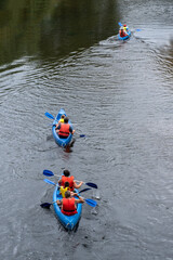 Group of people in the canoe paddling in holiday time