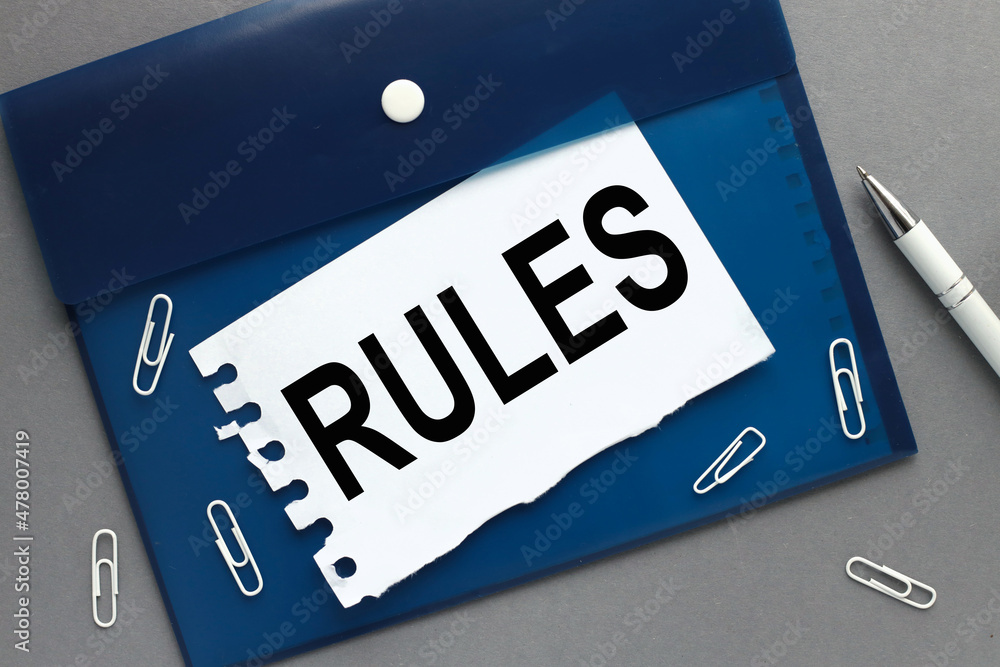 Poster rules word. clipboard with white blank sheet of paper on gray isolated background space.