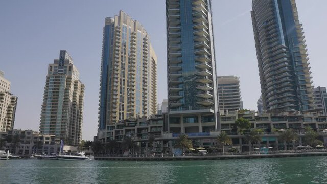 Buildings on the Dubai Marina Front Slow Moving Pan Up
