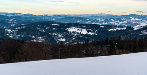 View from Cieslar hill summit in winter Beskid Slaski mountains on polish - czech borders