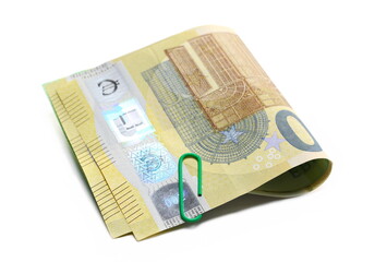 Two hundred euro banknotes, cash paper money and paper clips isolated on white  