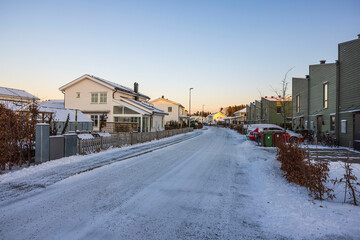 Beautiful view of snowy street of modern village. Europe. Sweden.