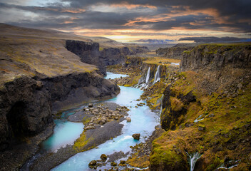 Beautiful sunset and landscape of Sigoldugljufur canyon with many small waterfalls and the blue river in Highlands of Iceland