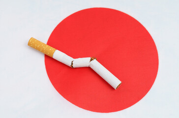 A broken cigarette is on the flag of Japan, as a symbol of the harm of smoking.