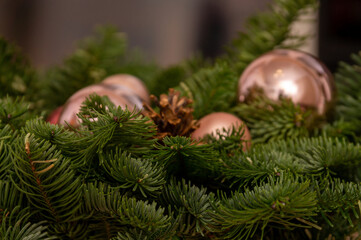 Fototapeta na wymiar nobilis branches decorated with bronze glass balls and cones