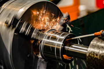 Sparks from a grinding wheel when machining a hole on a cylindrical grinder.