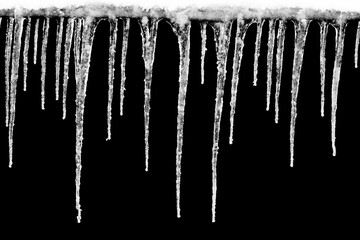 natural icicles isolated on a black background