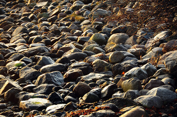 Boulders on a beach. Colorful stones. Horizontal photo.