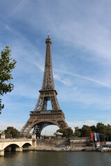 Fototapeta na wymiar Eiffel Tower at midday with the river Seine