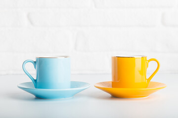 Colorful cups of Turkish coffee view over white studio. Minimal style with copy space.
