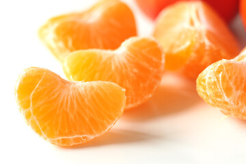 unpeeled slices of yellow mandarin