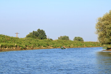 Danube Delta landscape with fishing boat in Romania