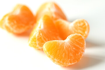 unpeeled slices of yellow mandarin