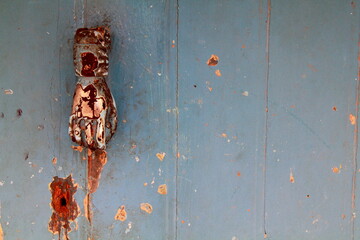 Grunge background : obsolete rusty door knocker