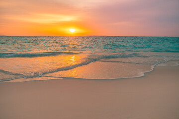 Closeup sea sand beach. Panoramic beach landscape. Inspire tropical beach seascape horizon. Colorful golden sunset sky calmness tranquil relaxing sunlight summer vibes. Vacation travel holiday banner